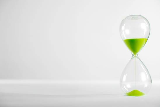 Hourglass with green sand